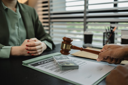 a client is bribing the opposing lawyer in order to win a case, the lawyer is acting unethically and illegally because he is receiving bribes form his client's opponentの写真素材
