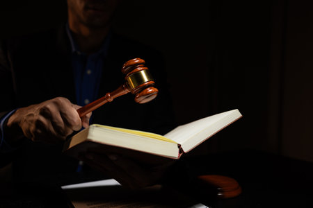 a lawyer was working overtime in the lawyers council office until late at night, the lawyer remained in the office because there were many client documents that needed to be checkedの写真素材