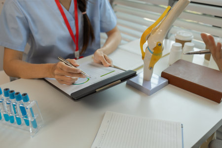 consultation between two doctors in the office, two medical students are discussing treatment guidelines for a patient assigned to them by a senior physician, nurse, brainstorming, hospitalの写真素材