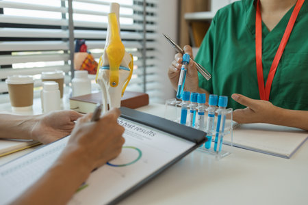 consultation between two doctors in the office, two medical students are discussing treatment guidelines for a patient assigned to them by a senior physician, nurse, brainstorming, hospitalの写真素材