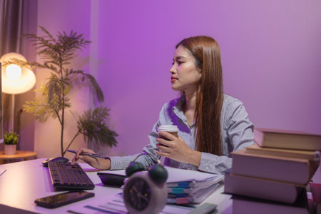 one employee felt very tired, sleepy, and stressed form working overtime because the work she was responsible for was too much to do alone, overworked, tired, exhausted, businesswomanの写真素材