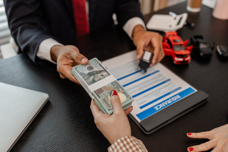 the car owner brought the car insurance policy she had taken out to her lawyer to review and have him approve everything as correct, money, insurance, approve, lawyerの写真素材