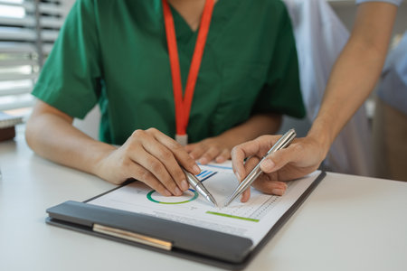 consultation between two doctors in the office, two medical students are discussing treatment...