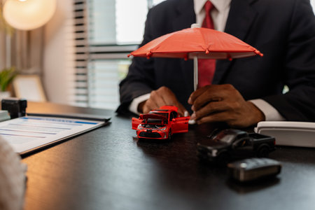 a lawyer explains the details of a car insurance policy and all the costs to a client, a lawyer explains to a client what will happen if she dose not have car insuranceの写真素材