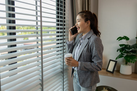a female employee is working, a businesswoman is handling urgent financial matters, a young entrepreneur is thinking of marketing strategies for her companyの写真素材