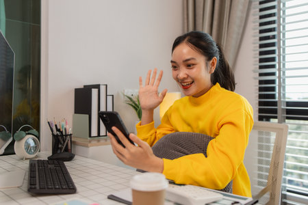 a businesswoman is working at home on the weekend, an employee had to take work home because there were so many documents she had to edit that she couldn't finish them in her working hoursの写真素材