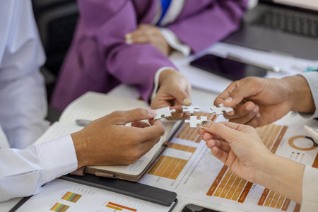 entrepreneurs brainstorm together to develop new products in a conference room, businesspeople share knowledge on marketing strategies and finance with each other, accountant, businessmanの写真素材