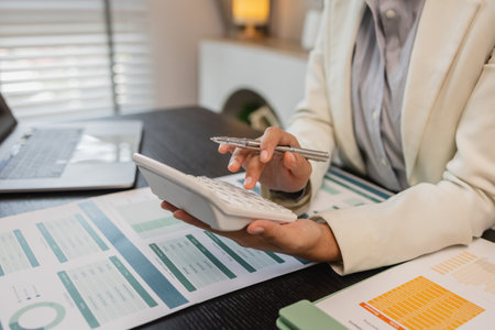 working in the office with a lot of paper work, businessman is checking marketing data, e an employee is working with finance document, sitting in the office working for accountant companyの写真素材