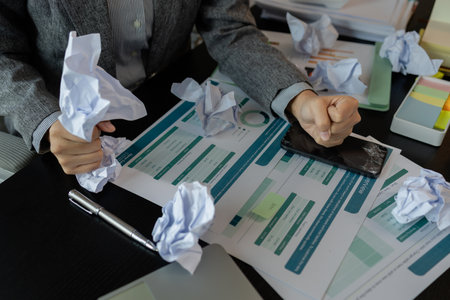 a female employee is extremely stressed at work, a businesswoman is stressed because the deadline...