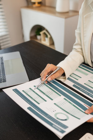 working in the office with a lot of paper work, businessman is checking marketing data, e an employee is working with finance document, sitting in the office working for accountant companyの写真素材