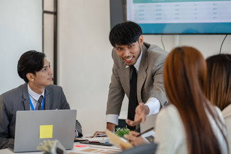 employees are discussing marketing strategies in a conference room, businesspeople are discussing the investment they will make together, accounting, brainstorming, financeの写真素材