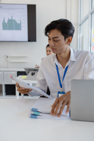 the atmosphere of the company's employees working together, the finance department staff work with...