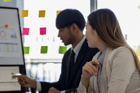 entrepreneurs brainstorm together to develop new products in a conference room, businesspeople share...