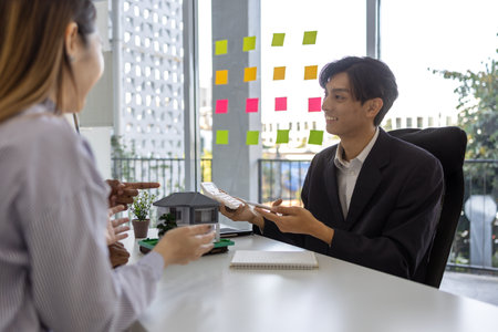 concept for selling a house and home insurance. Signing a house purchase and sale agreement, housing rental, mortgage, real estate, rent, selling, loan, property, agentの写真素材