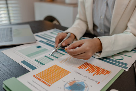 businessman is checking financial documents to match the information summarized by the accounting...