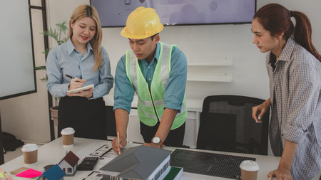 the architect and his team are meeting with the construction supervisor to brainstorm on how to...