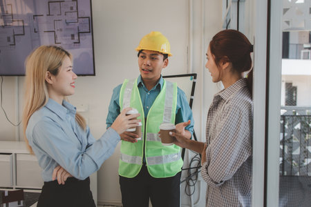 the architect discusses the content of the construction project that has just been concluded with the engineer to summarize again that they have a common understanding of the content of the meetingの写真素材