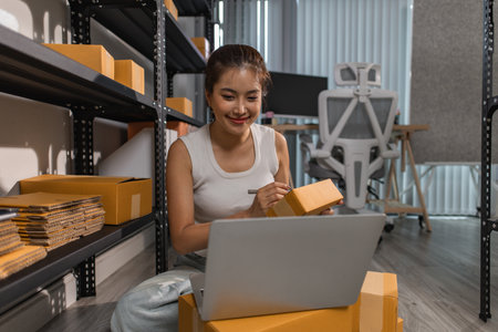 a female employee is checking parcel boxes in a warehouse, a warehouse manager is counting parcel...