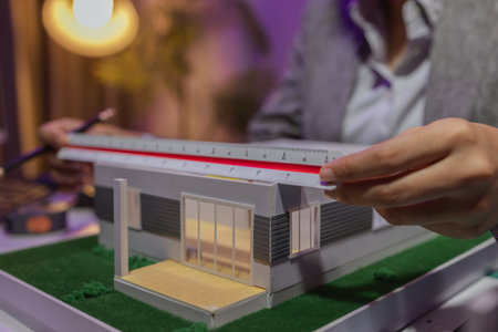 a passionate female architect works in her private office to remodel a house to meet her client's...