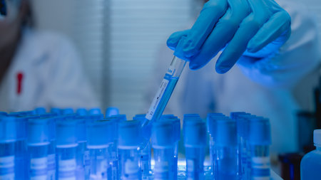 a female chemist is testing various liquid compounds in a lab, a scientist is doing research on the development of science in a lab, laboratory, test tube, scientificの写真素材