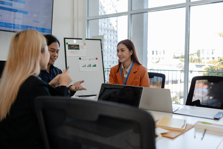 group of businessman are brainstorming about their business project, these entrepreneurs are meeting about finance, accounting and marketing in the office, presentation, discussingの写真素材