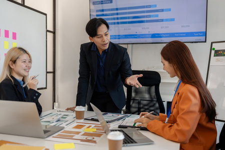 group of businessman are brainstorming about their business project, these entrepreneurs are meeting about finance, accounting and marketing in the office, presentation, discussingの写真素材