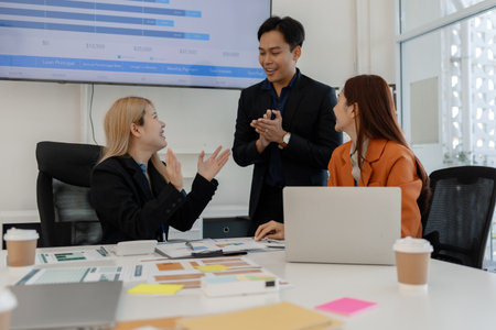 businessman is discussing with his team about business, group of entrepreneur are brainstorming in...