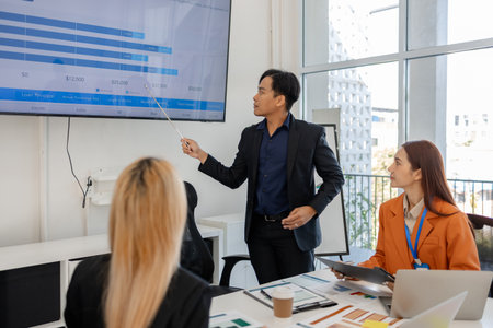 group of businessman are brainstorming about their business project, these entrepreneurs are meeting about finance, accounting and marketing in the office, presentation, discussingの写真素材