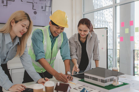 the architect and his team are meeting with the construction supervisor to brainstorm on how to...