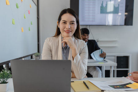 the atmosphere of the company's employees working together, the finance department staff work with the accounting department, a group of businessmen are exchanging insights with each otherの写真素材