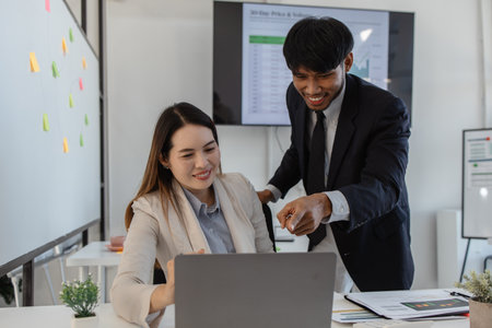 the atmosphere of the company's employees working together, the finance department staff work with the accounting department, a group of businessmen are exchanging insights with each otherの写真素材