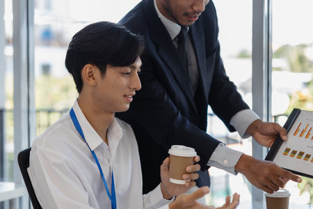group of business people are meeting in a conference room, entrepreneurs meet to share knowledge with each other, marketing staff are discussing in formation about the work that needs to be presentedの写真素材