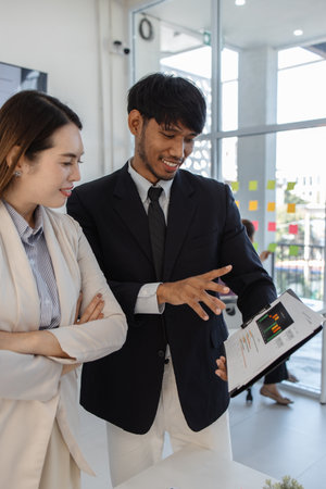 group of business people are meeting in a conference room, entrepreneurs meet to share knowledge with each other, marketing staff are discussing in formation about the work that needs to be presentedの写真素材