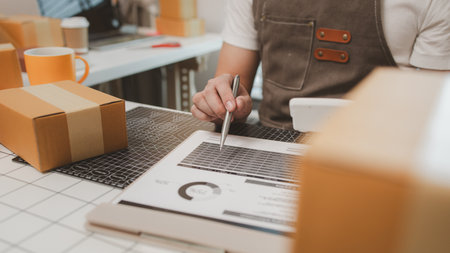 a packer is working in a room at a shipping company, an entrepreneur is a small business owner selling small items online, a businessman is working in his shipping company, parcel, productの写真素材