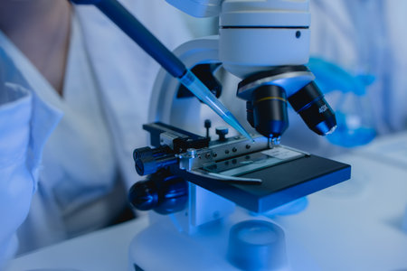 two scientists are working together to find a new antiviral drug, two chemists are using scientific...
