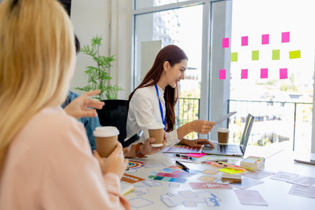 ux, ui, mobile app web designers are brainstorming to design a visual display that customers will see and feel comfortable using so color tones and layouts must be carefully selectedの写真素材