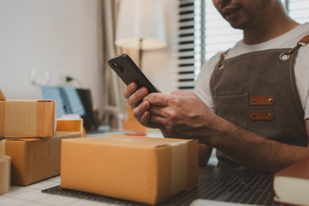 a packer is working in a room at a shipping company, an entrepreneur is a small business owner selling small items online, a businessman is working in his shipping company, parcel, productの写真素材