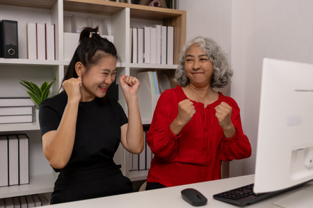 a mother and daughter are spending their free time together at home, the daughter spends his weekend visiting his elderly mother, a family full of love between a mother and daughterの写真素材
