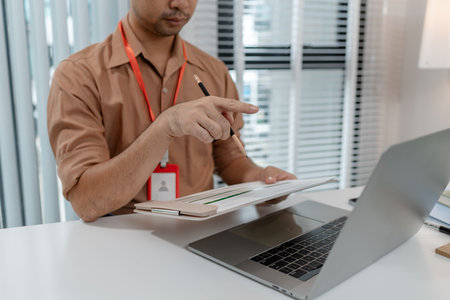 businessman is working in his private office, marketing manager works with a lot of paperwork, an...