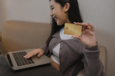 she enjoys shopping online by paying wit her credit card, the balance on her debit card is enough...