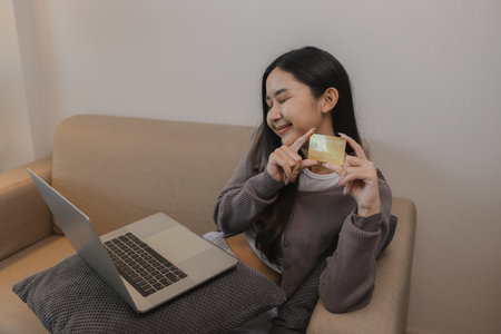 she enjoys shopping online by paying wit her credit card, the balance on her debit card is enough...