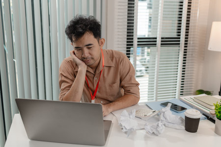 a businessman stressed because of the deal with his partner not complete, an accountant is ver stressed because the company's profits have disappeared a lot, stressful,の写真素材