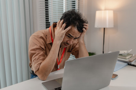 a businessman stressed because of the deal with his partner not complete, an accountant is stressed because the company's profits have decreased significantly, stressful,の写真素材