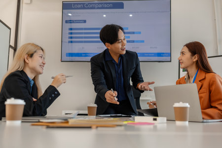 one of marketing team is explaining the presentation to the team, group of businessman are meeting in the office, these entrepreneur are brainstorming about their business project, finance, accountingの写真素材