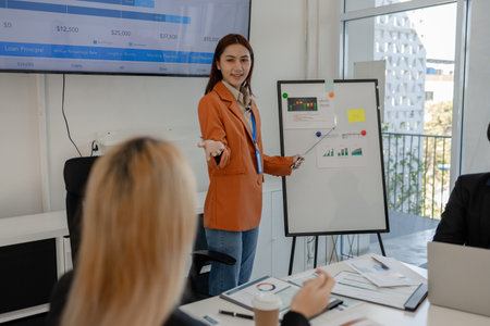 one of marketing team is explaining the presentation to the team, group of businessman are meeting...