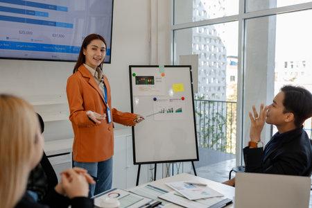 one of marketing team is explaining the presentation to the team, group of businessman are meeting in the office, these entrepreneur are brainstorming about their business project, finance, accountingの写真素材