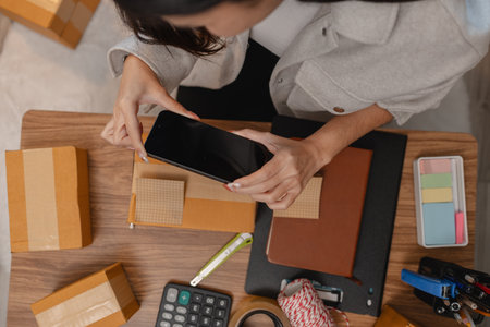 she in an entrepreneur, she sells product online, she own a small business that sell product online, sme, a lot of parcel stack in the room, working in her shopping online storageの写真素材
