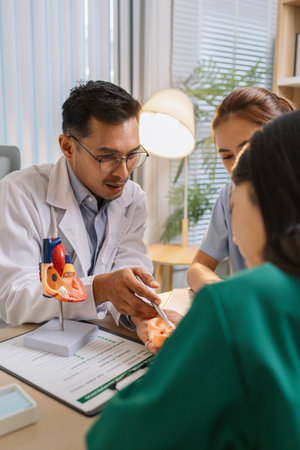 Medical professionals collaborating during a meeting to discuss patient care plans and treatment strategies. Doctors and nurses share expertise and analyze clinical data for better healthcare outcomesの写真素材