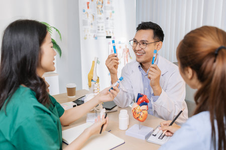 Group of doctors and nurses consulting about a complex patient case in hospital office. Team analyzing medical data and discussing diagnostic plans for accurate and efficient treatment.の写真素材