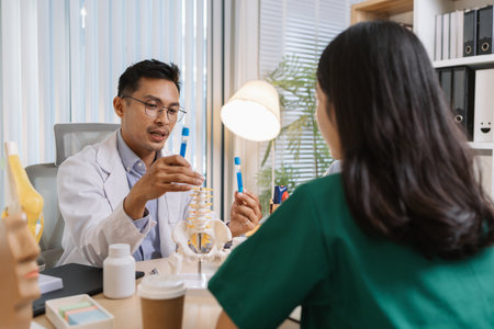 Group of doctors and nurses consulting about a complex patient case in hospital office. Team analyzing medical data and discussing diagnostic plans for accurate and efficient treatment.の写真素材